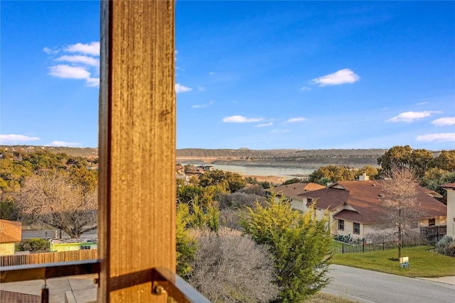 property view of water featuring fence