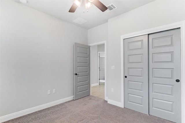 20104 Byrd Ave, Lago Vista, TX 78645 - unfurnished bedroom with light carpet, a closet, and ceiling fan