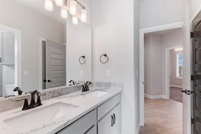 20104 Byrd Ave, Lago Vista, TX 78645 - bathroom featuring double vanity and wood finished floors