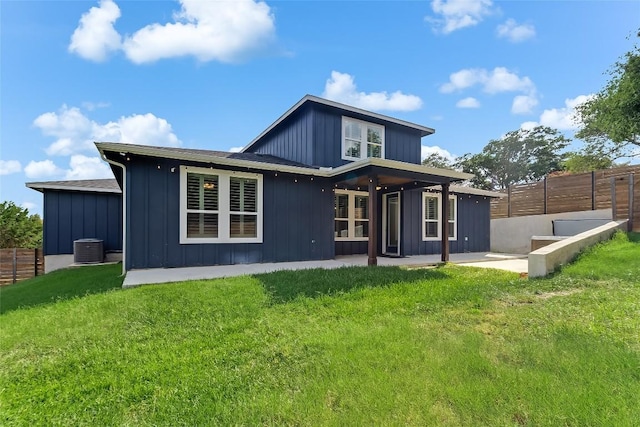 20104 Byrd Ave, Lago Vista, TX 78645 - back of house featuring board and batten siding and a patio