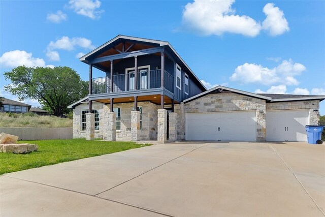 20104 Byrd Ave, Lago Vista, TX 78645 - contemporary home featuring stone siding, driveway, an attached garage, and a balcony