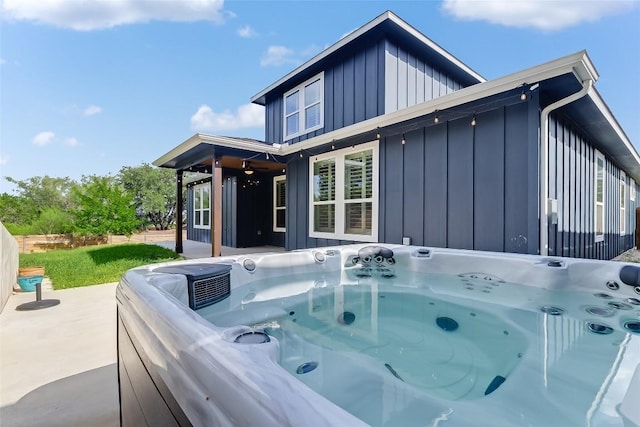 20104 Byrd Ave, Lago Vista, TX 78645 - back of house featuring board and batten siding and a hot tub
