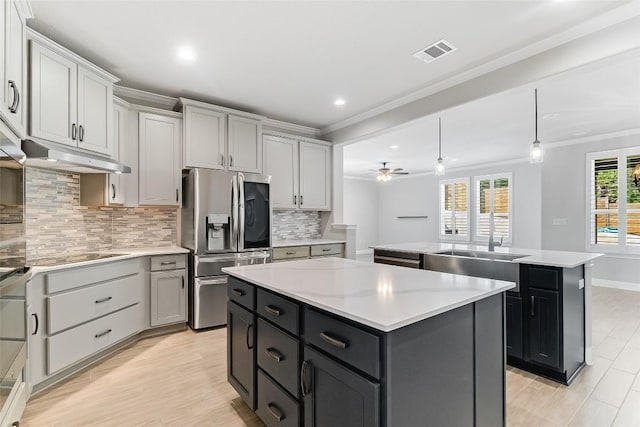 20104 Byrd Ave, Lago Vista, TX 78645 - kitchen with a center island, stainless steel fridge with ice dispenser, crown molding, backsplash, and light countertops