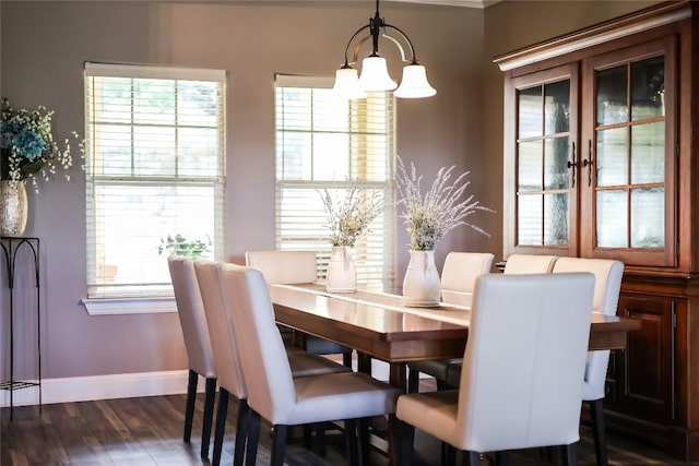 dining room featuring dark wood-type flooring and a notable chandelier