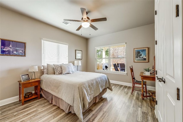 bedroom featuring ceiling fan and light hardwood / wood-style floors