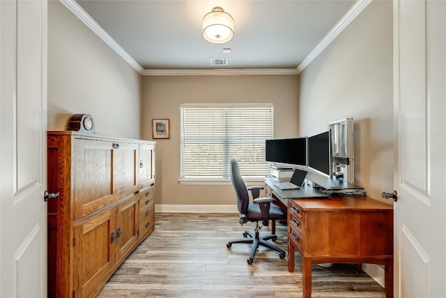 office with light wood-type flooring and crown molding