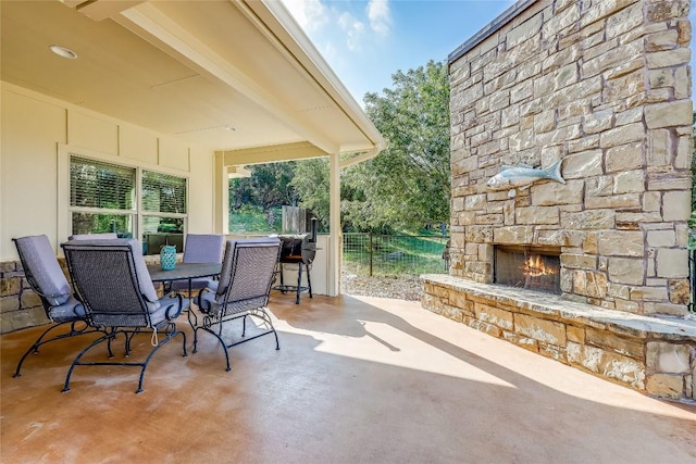 view of patio / terrace with an outdoor stone fireplace