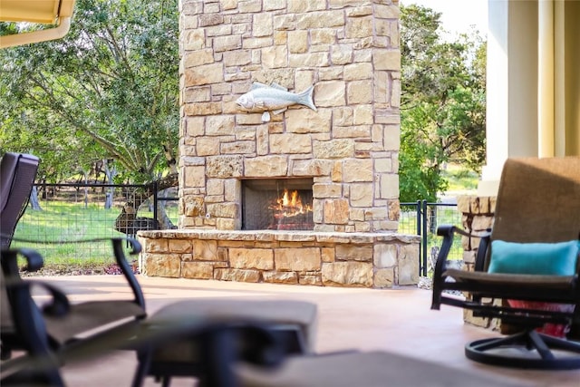 view of patio / terrace with an outdoor stone fireplace