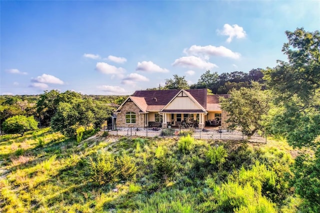 3500 Lohmans Ford Rd Unit 71, Lago Vista, TX 78645 - rear view of house featuring stone siding, a patio, and board and batten siding