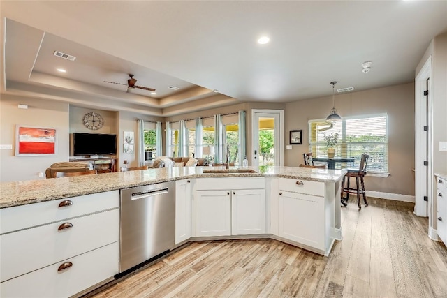 3500 Lohmans Ford Rd Unit 71, Lago Vista, TX 78645 - kitchen featuring dishwasher, light wood-style flooring, white cabinetry, light stone countertops, and open floor plan