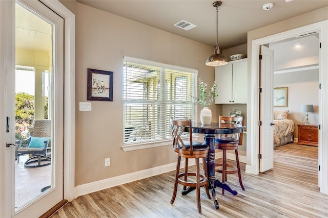 dining space with light wood-type flooring