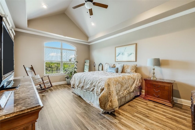 bedroom featuring light wood-type flooring, high vaulted ceiling, ceiling fan, and ornamental molding