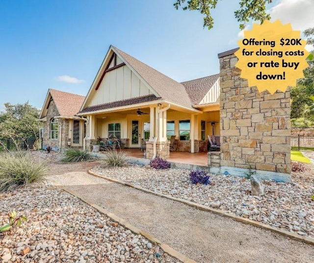 3500 Lohmans Ford Rd Unit 71, Lago Vista, TX 78645 - back of property with board and batten siding, stone siding, a ceiling fan, and a shingled roof