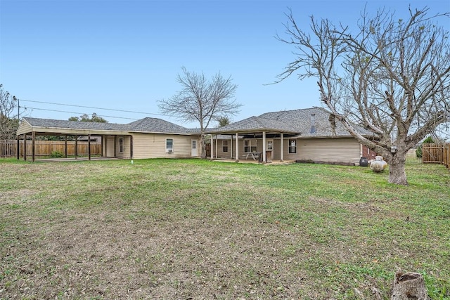 back of house with a yard