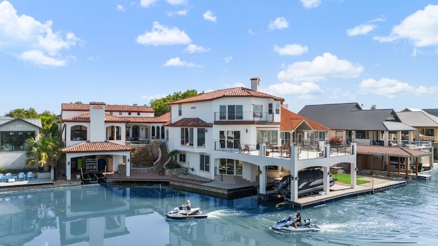 rear view of property featuring a water view