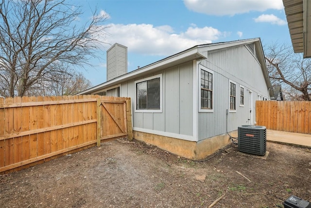 view of side of home featuring cooling unit