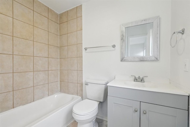 full bathroom with vanity, tiled shower / bath combo, and toilet