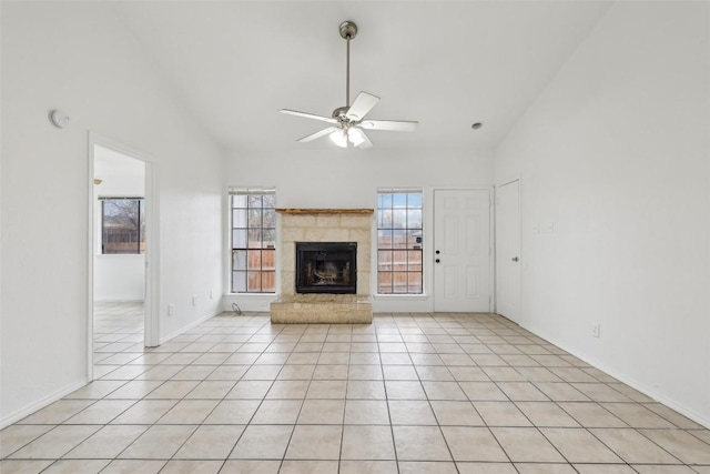 unfurnished living room featuring high vaulted ceiling, a tiled fireplace, ceiling fan, and light tile patterned flooring