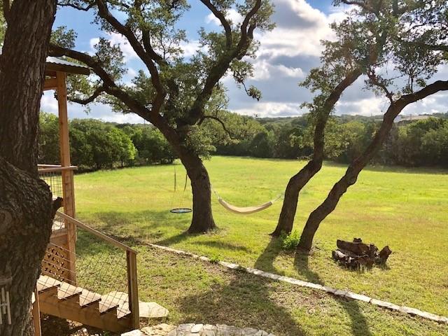 view of home's community featuring a lawn