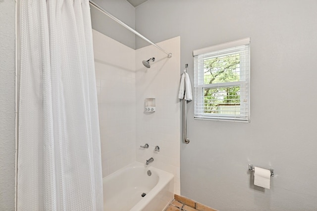 bathroom featuring tile patterned floors and shower / bathtub combination with curtain