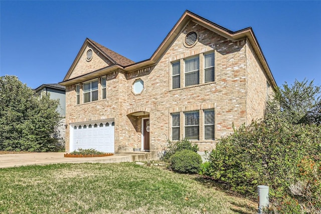 view of front of property featuring a front yard and a garage