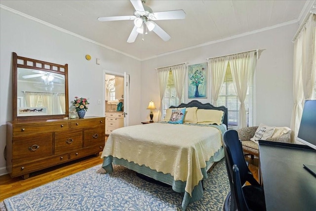 371 Youngs Prairie Rd, Elgin, TX 78621 - bedroom featuring wood finished floors, ornamental molding, and a ceiling fan