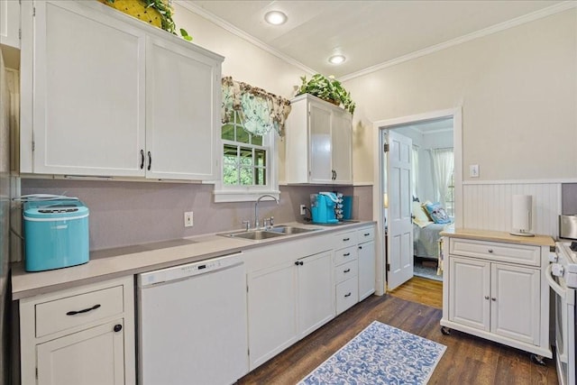 kitchen with white appliances, crown molding, sink, dark hardwood / wood-style floors, and white cabinetry