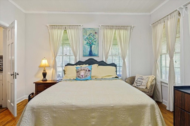 371 Youngs Prairie Rd, Elgin, TX 78621 - bedroom with multiple windows, wood finished floors, ornamental molding, and baseboards