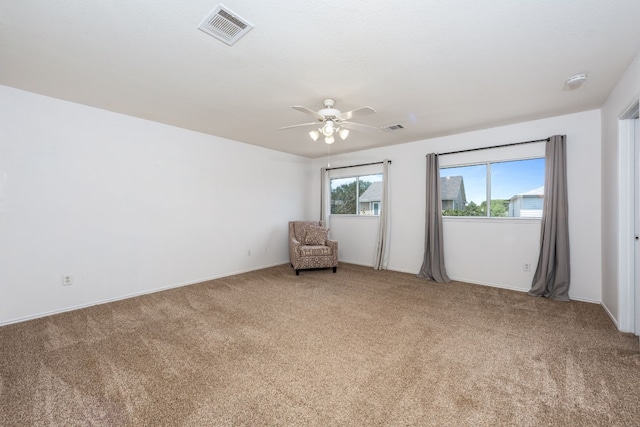 unfurnished room featuring carpet and ceiling fan