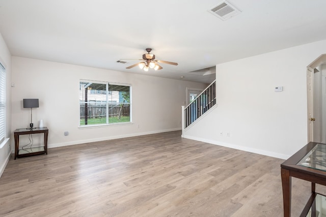 living room featuring ceiling fan and light wood-type flooring