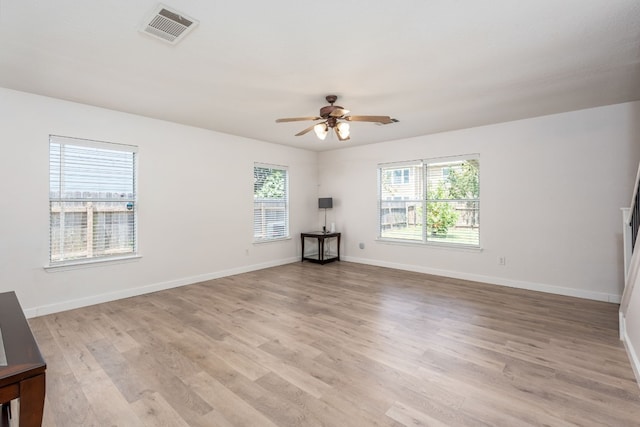 unfurnished room featuring ceiling fan and light wood-type flooring