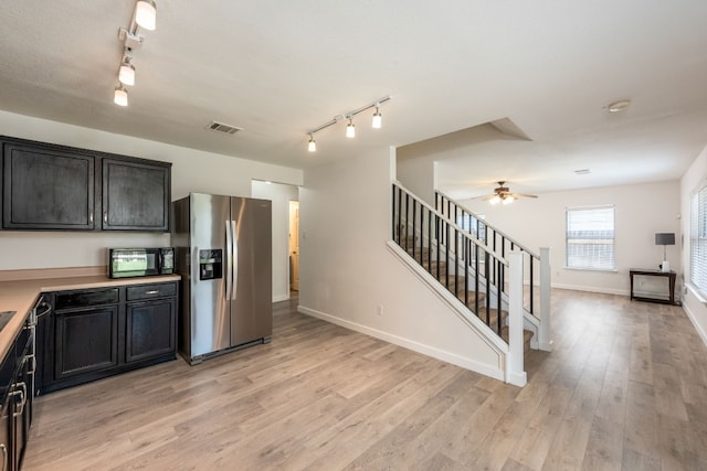 kitchen featuring stainless steel refrigerator with ice dispenser, light wood-type flooring, rail lighting, and ceiling fan