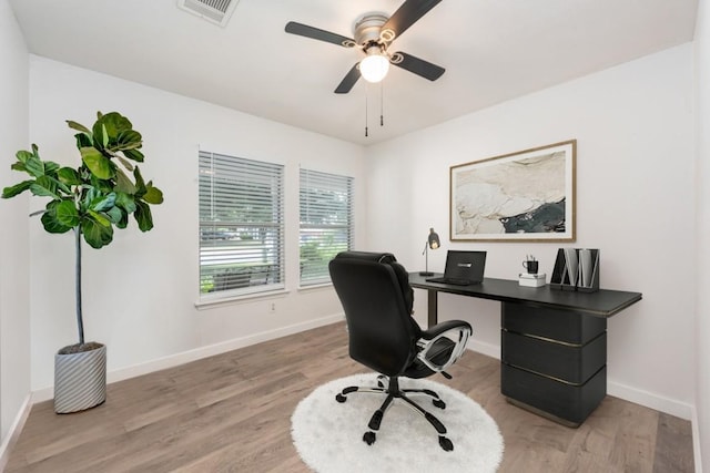 home office with ceiling fan and wood-type flooring