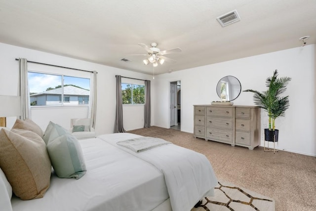 carpeted bedroom with ceiling fan