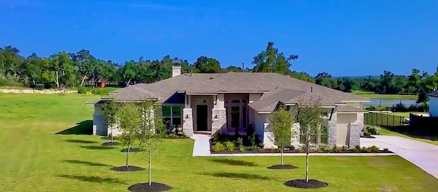 view of front of house with a front lawn and a garage