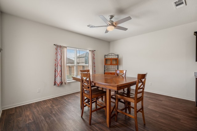 dining area with dark hardwood / wood-style flooring and ceiling fan