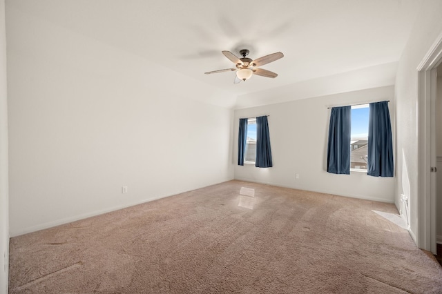 empty room featuring carpet flooring and ceiling fan