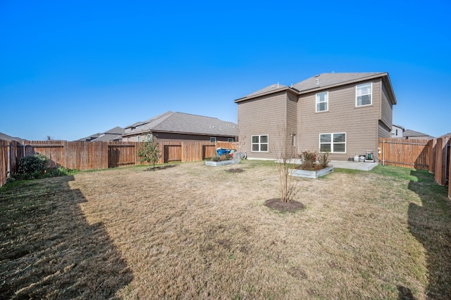 14405 Boomtown Way, Elgin, TX 78621 - rear view of house with a fenced backyard and a patio