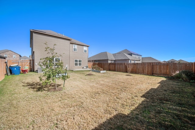 back of house with a yard