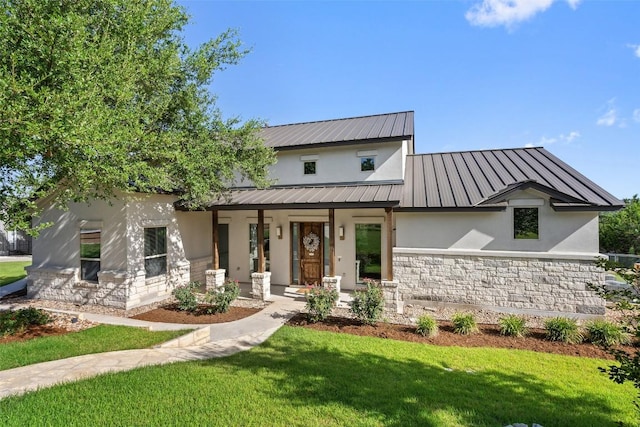 modern farmhouse with covered porch and a front yard