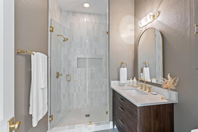 bathroom with vanity and walk in shower