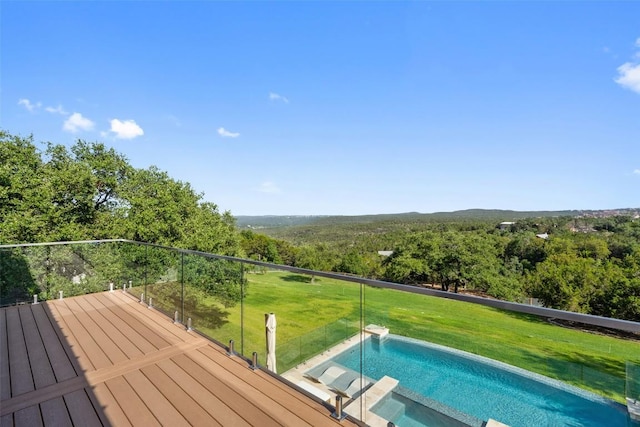 view of pool with a lawn