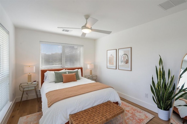 bedroom with hardwood / wood-style flooring and ceiling fan