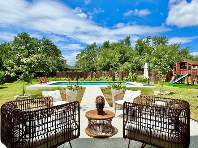 view of pool with an outdoor hangout area, a playground, a patio, and a yard