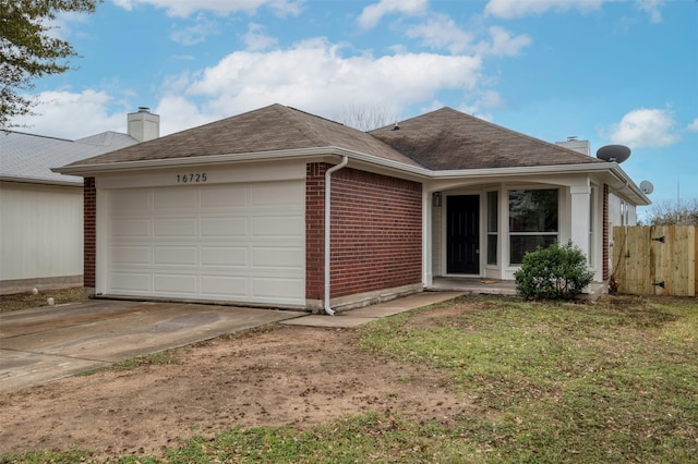 ranch-style home featuring a garage and a front yard