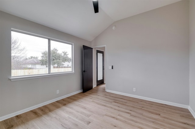 unfurnished bedroom featuring light hardwood / wood-style flooring, ceiling fan, and lofted ceiling