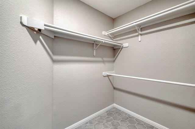 spacious closet with tile patterned floors