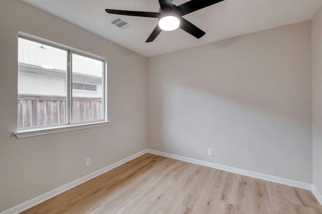 spare room featuring ceiling fan and light hardwood / wood-style flooring