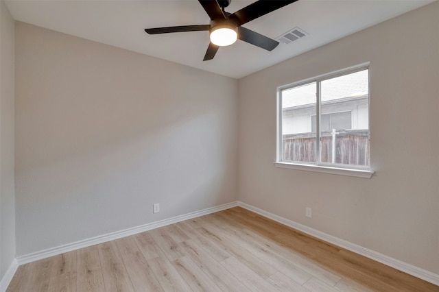 unfurnished room with ceiling fan and light wood-type flooring