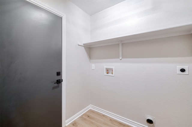 clothes washing area featuring hookup for a washing machine, hardwood / wood-style flooring, and electric dryer hookup